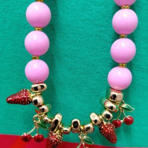 "Red fruits/pink necklace"